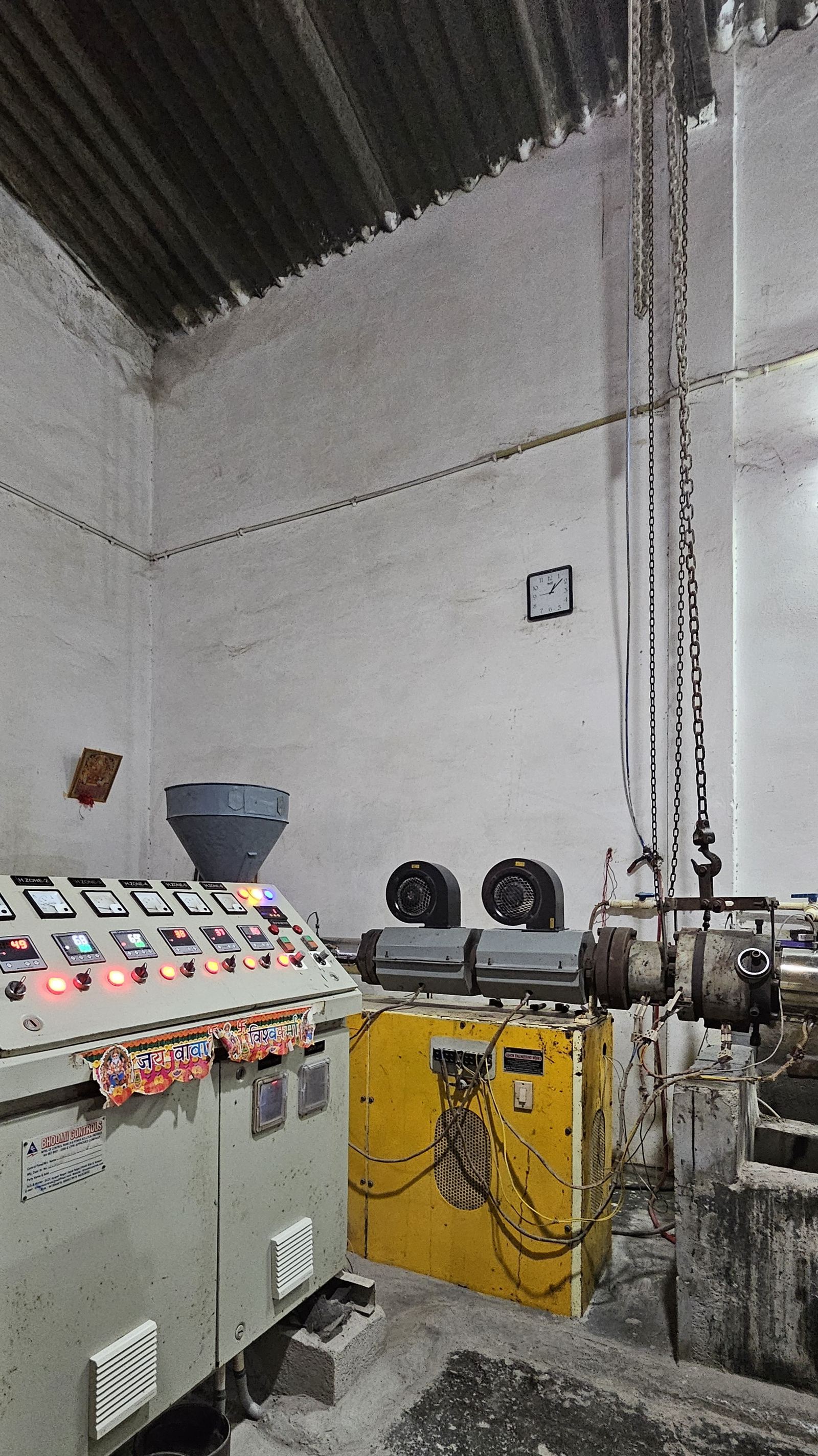 Inside the Perfit manufacturing facility — control room and extrusion line